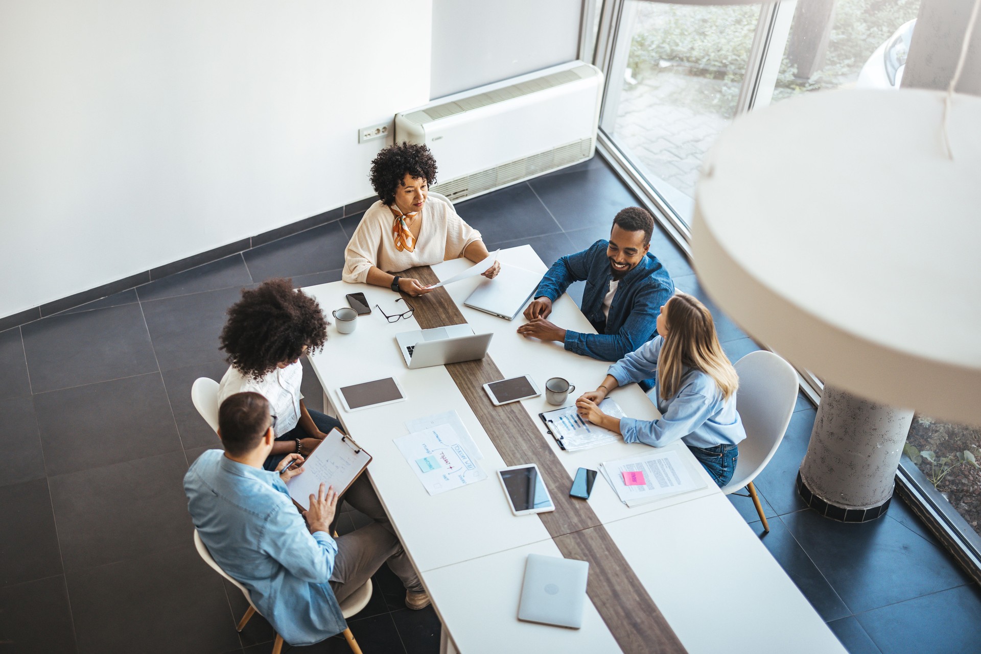 Diverse Team Collaborating In Modern Office Environment